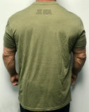 60% Cotton, 40% Poly. Military green Crew neck. shirt has a large screen print in greenish brown. logo is of a warrior helmet layered over and American flag. phrase “Peaceful Not Passive. The word “peaceful” is located at top of the flag/helmet and the words “not passive” is featured at bottom of the flag/helmet. back of the t-shirt features small simple “Joe Local” logo across top of t-shirt under the neck. left sleeve features a small screen print of the American flag in greenish brown.  Edit alt text