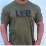 Front of the t-shirt. Military green t-shirt with navy blue Joe Local So Cal flag logo at the center of the chest. Well-fitted and comfortable t-shirt. Fabric: CVC Jersey 60% Combed Ring-Spun Cotton 40% Polyester /32 singles, 145 grams/4.3 oz Neck: Crew