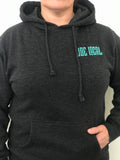 Women's mid-weight hoodie in dark gray. Joe Local mint green logo featured on left front pocket. Details of the fabric: Dark gray in color 80% Cotton/20% Polyester. jersey lined hood. Back of hoodie features large Joe Local flag logo in mint green featured at the bottom of the hoodie.